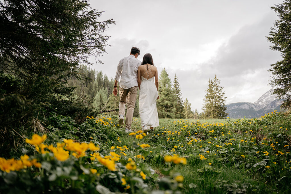 Couple walking in a scenic flower field