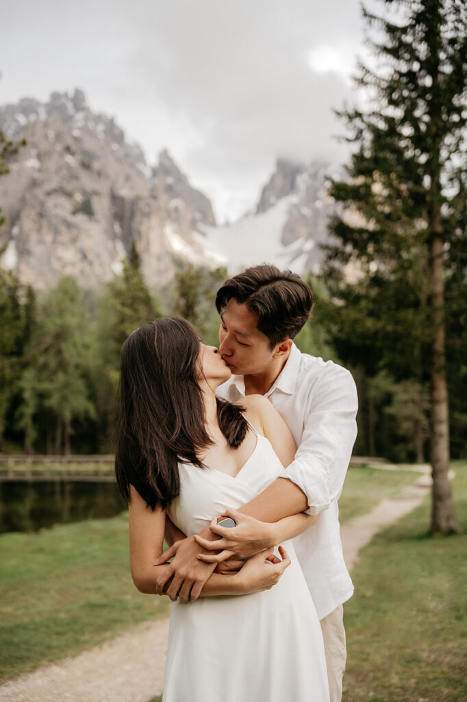 Couple kissing in scenic mountain landscape