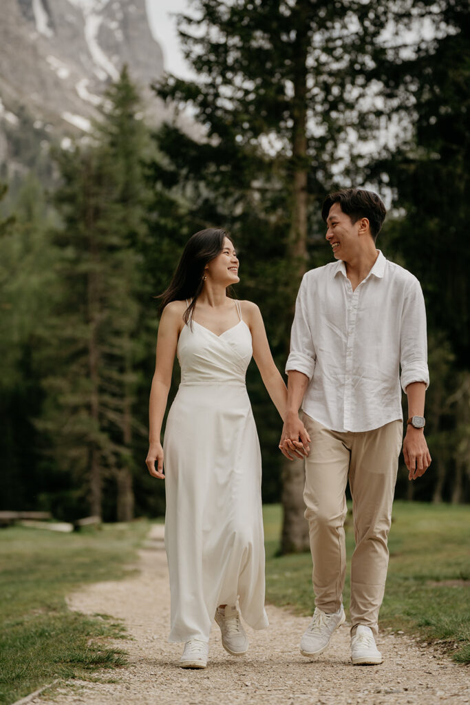 Couple walking joyfully in nature path