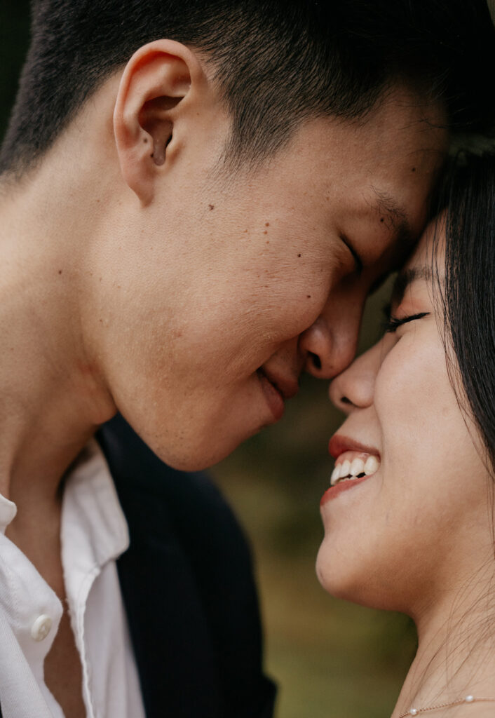 Close-up of couple smiling affectionately.