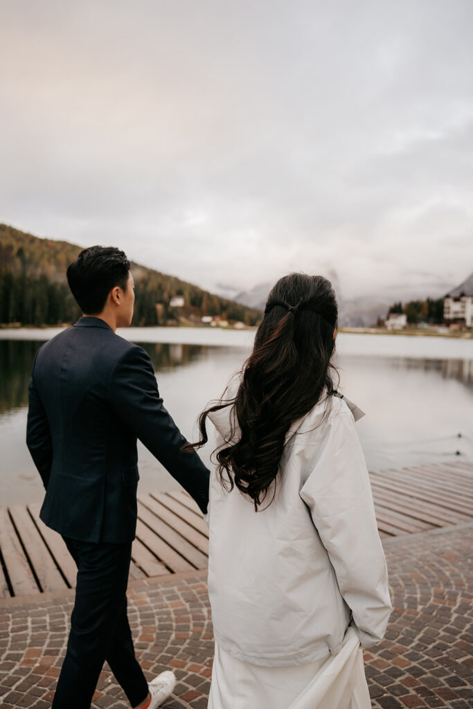 Couple walking by scenic lake view