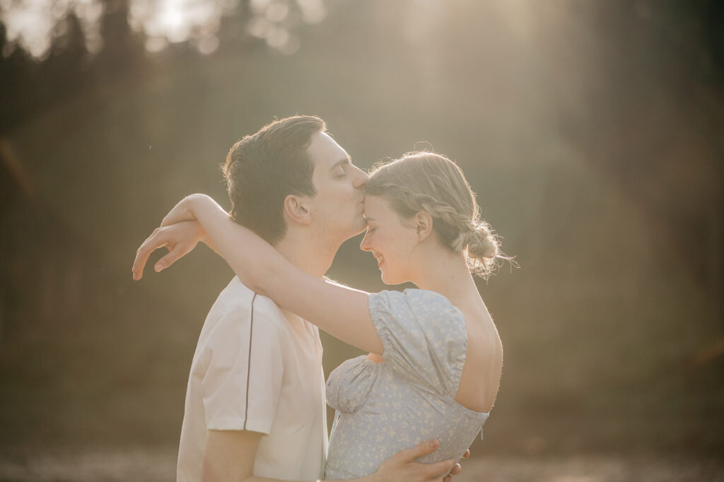 Romantic couple embracing in sunlight