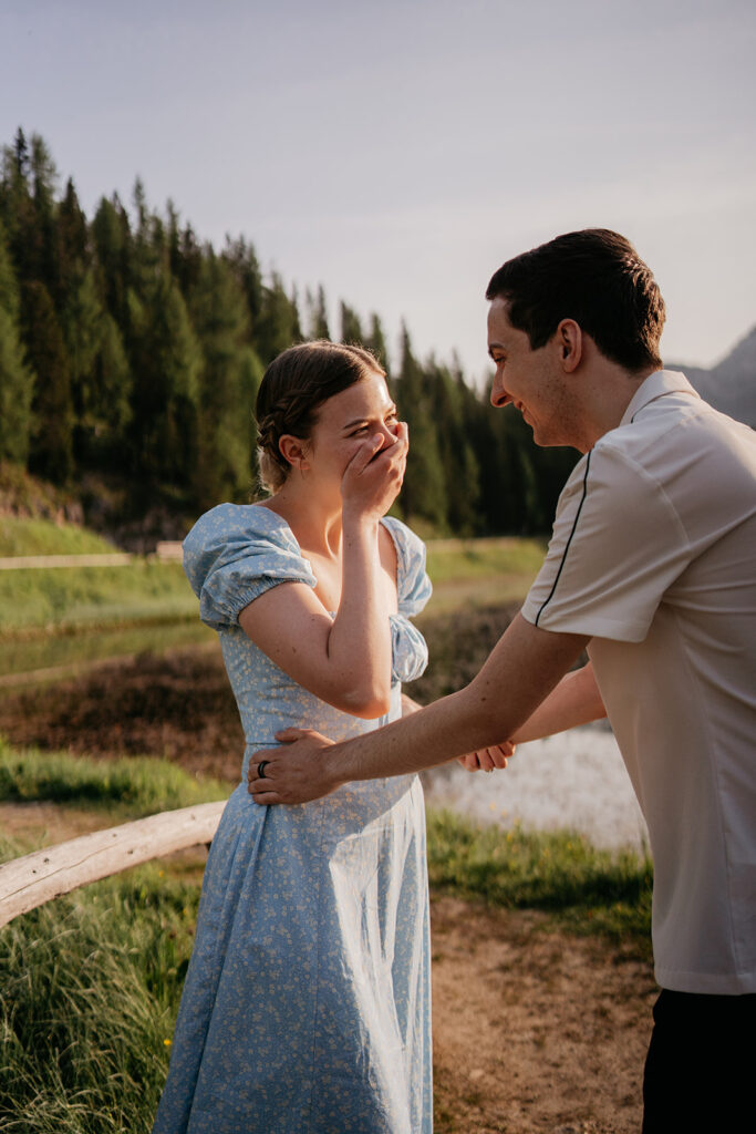 Smiling couple embracing outdoors in nature