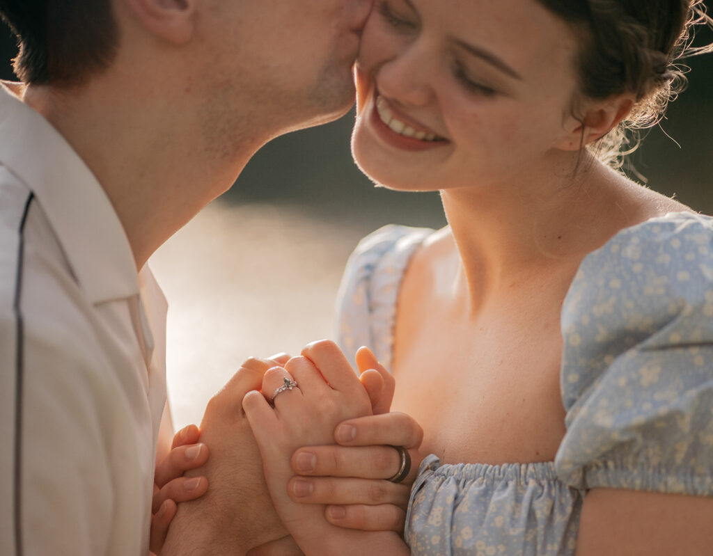 Couple holding hands, romantic embrace.