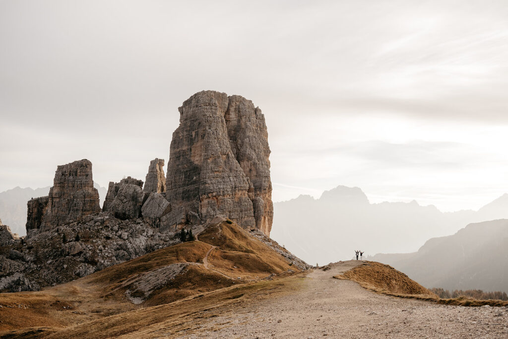 Hikers celebrating near Dolomite mountain peak