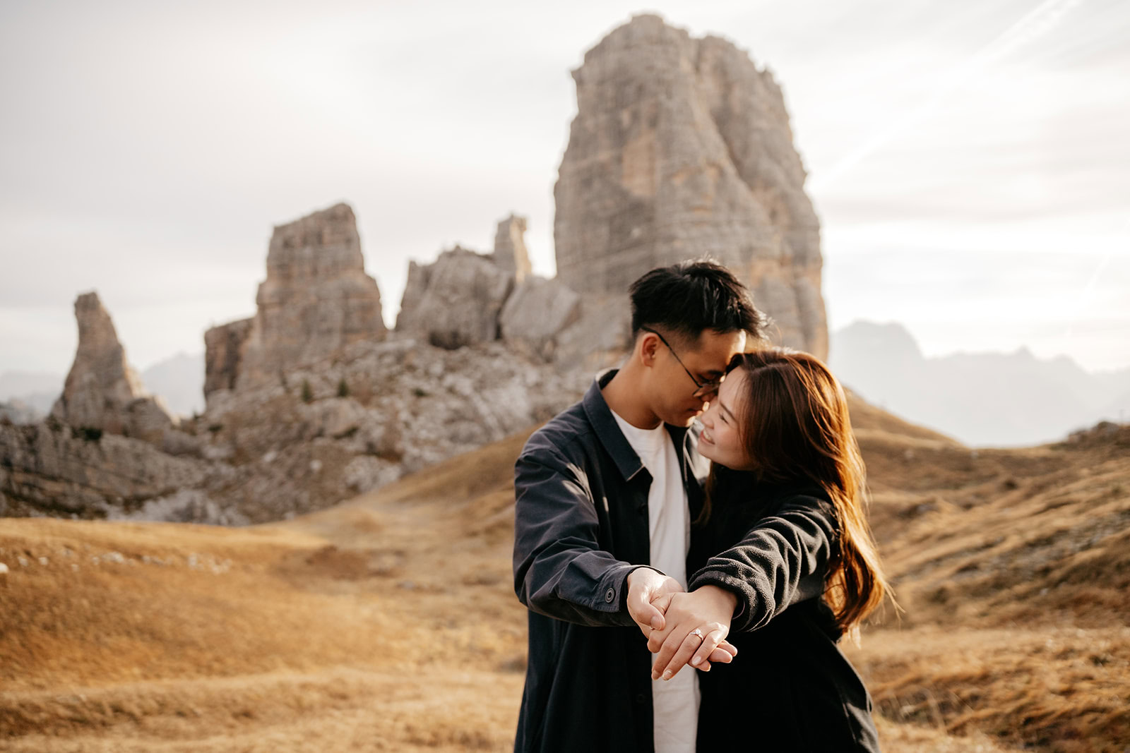 Couple embracing in a mountainous landscape