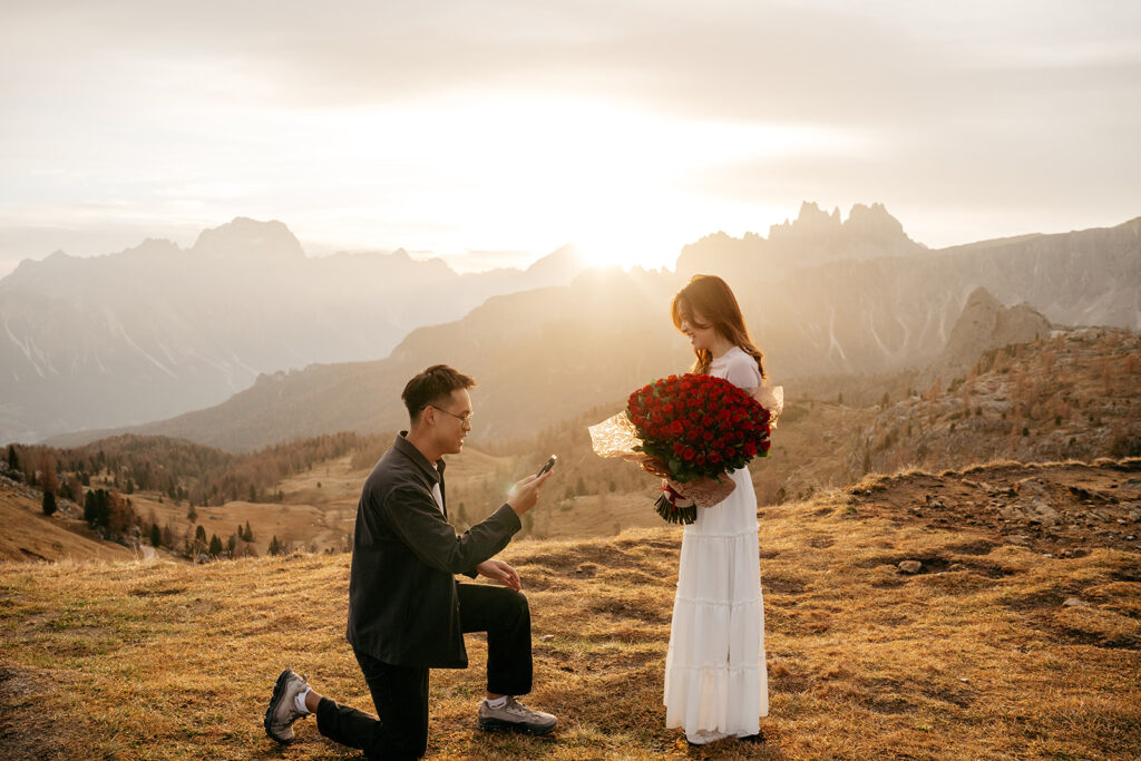 Man proposing with ring, sunset mountain view