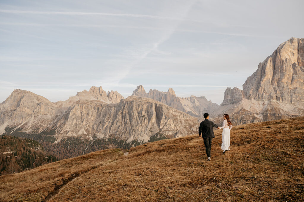 Couple walking in Dolomites mountain scenery