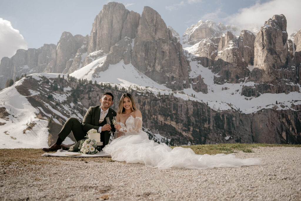 Bride and groom in mountain landscape wedding photo.