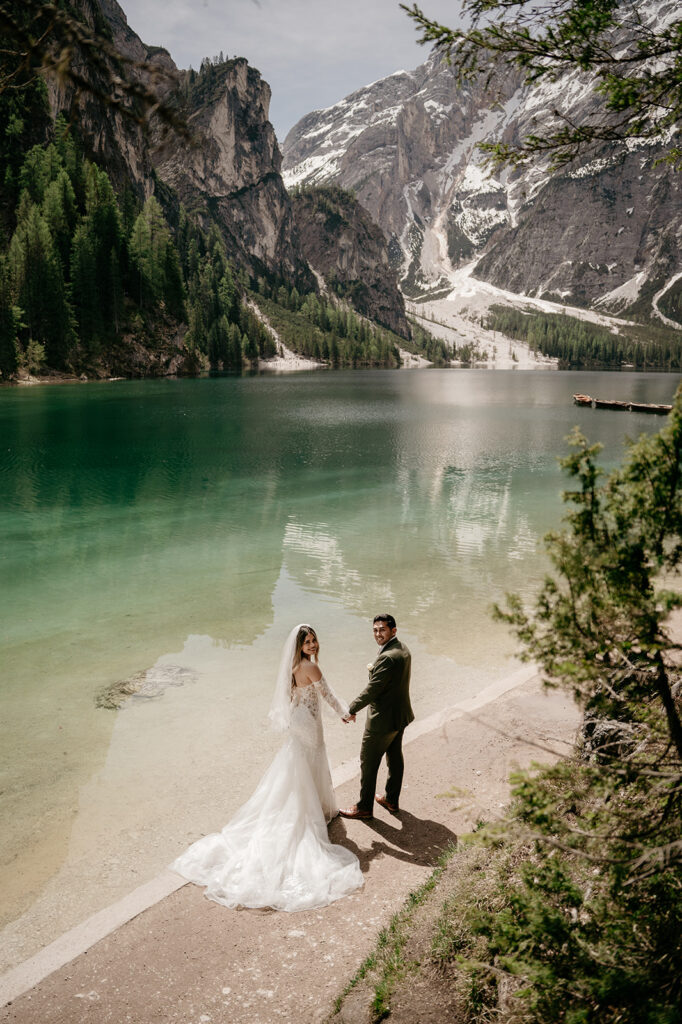 Bride and groom at lakeside mountain scenery