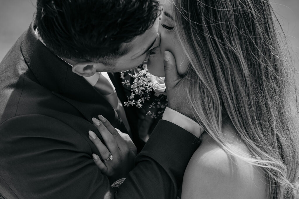 Black and white couple kissing tenderly