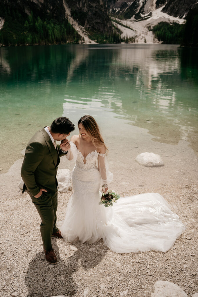 Bride and groom by a mountain lake