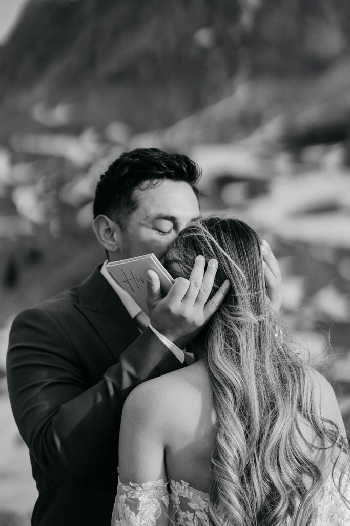 Couple embracing during emotional outdoor ceremony