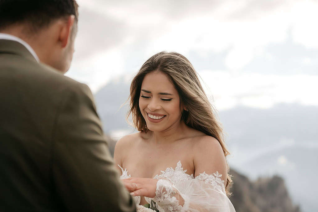 Woman smiling during outdoor wedding ceremony