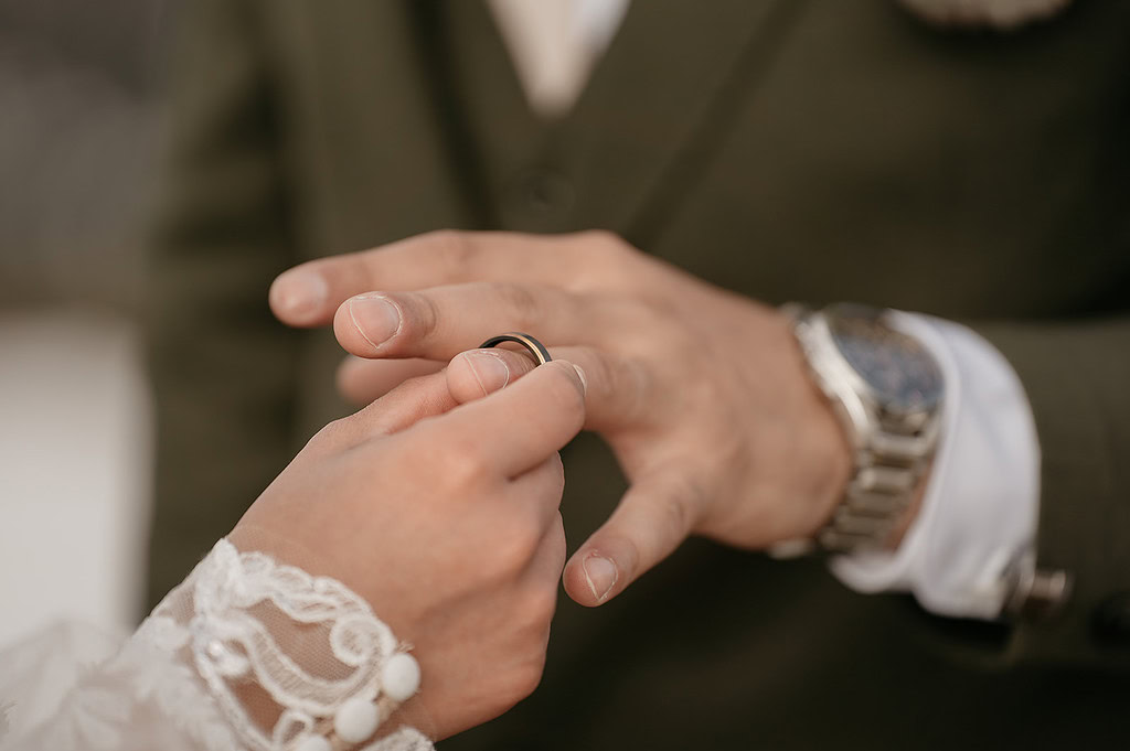 Wedding ring being placed on finger