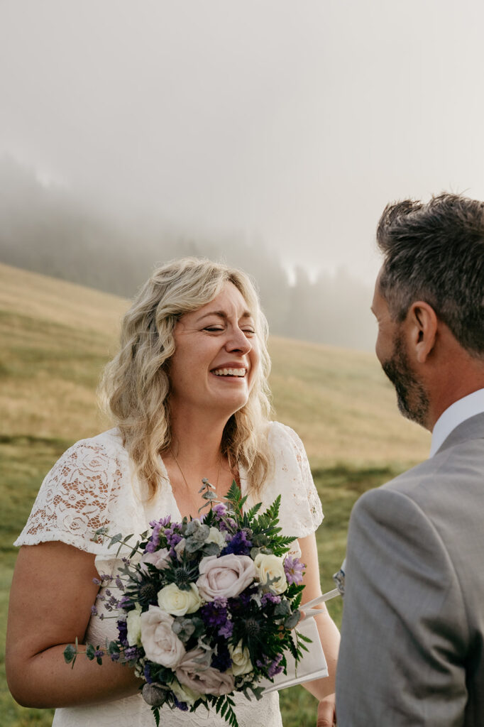 Bride smiling during outdoor wedding ceremony