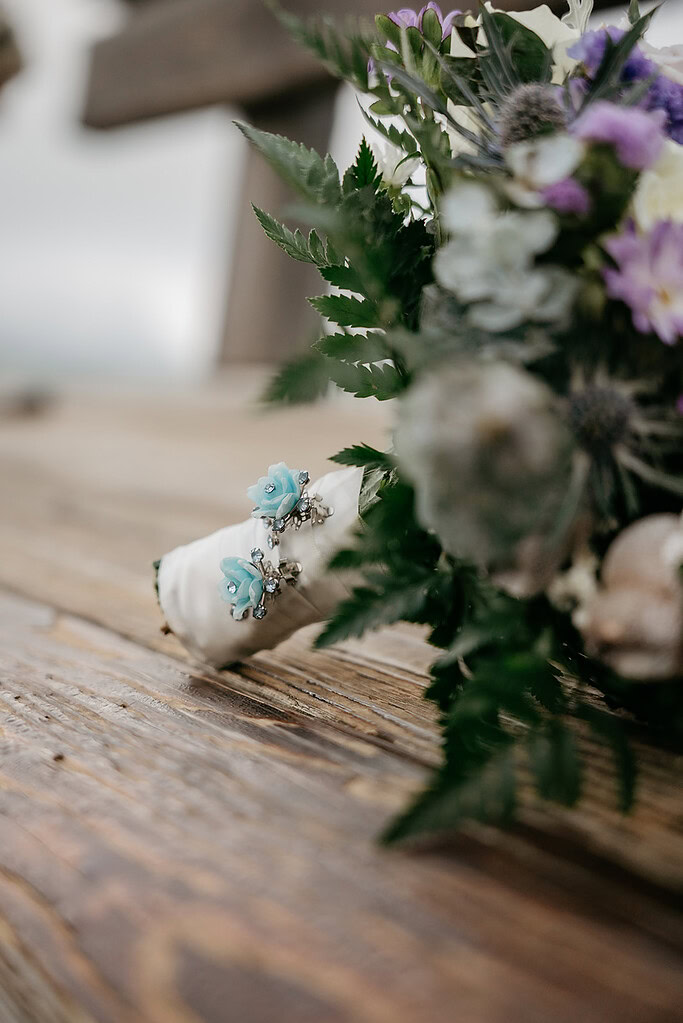 Close-up of wedding bouquet with blue flowers