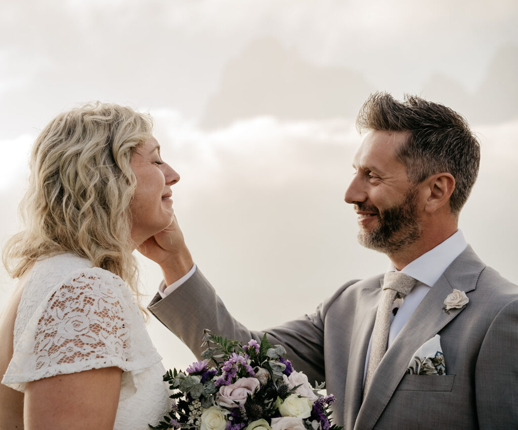 Smiling couple at outdoor wedding ceremony