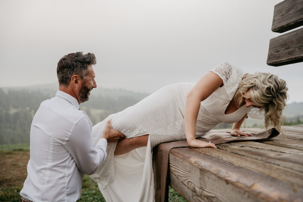 Bride and groom enjoying outdoor moment together.