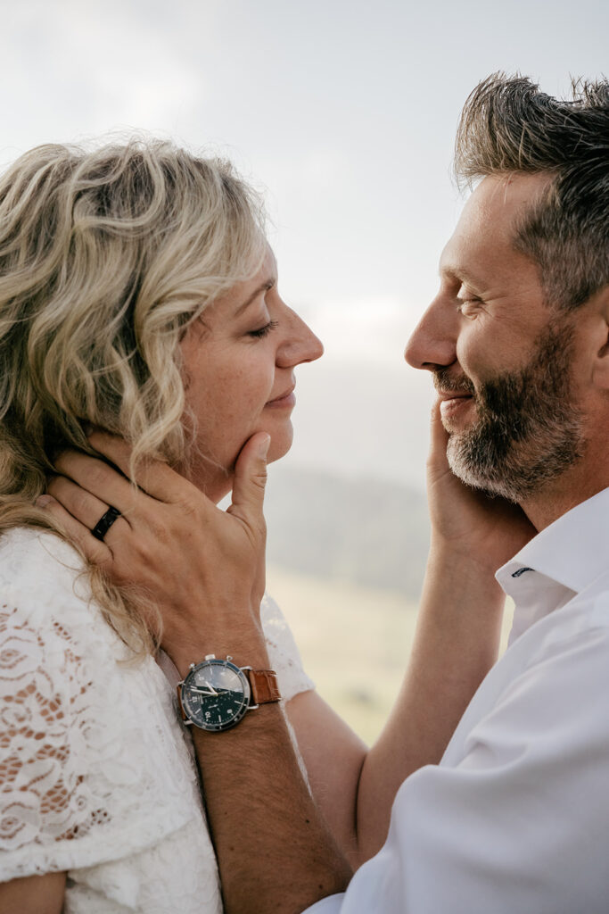 Couple smiling closely outdoors