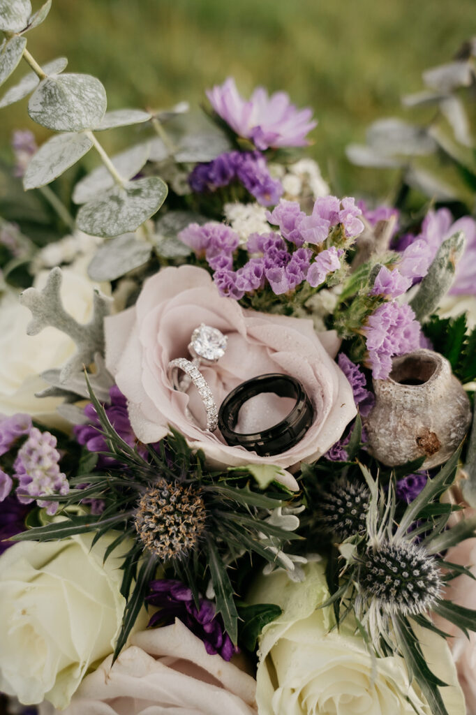 Wedding rings on a floral bouquet