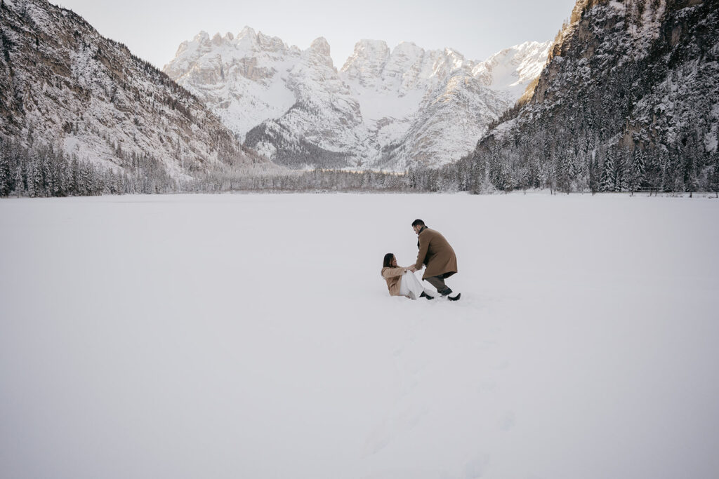 Couple in snowy mountain landscape