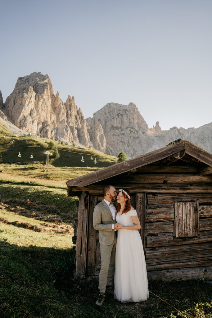 Bride and groom in scenic mountain setting.