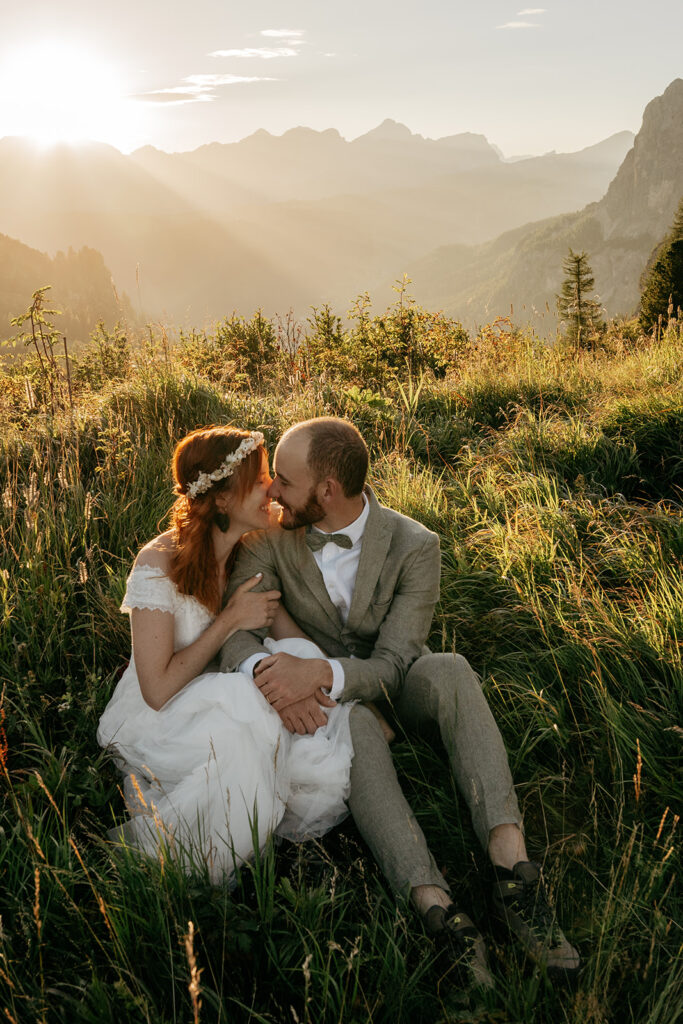 Couple embracing in mountain sunset landscape