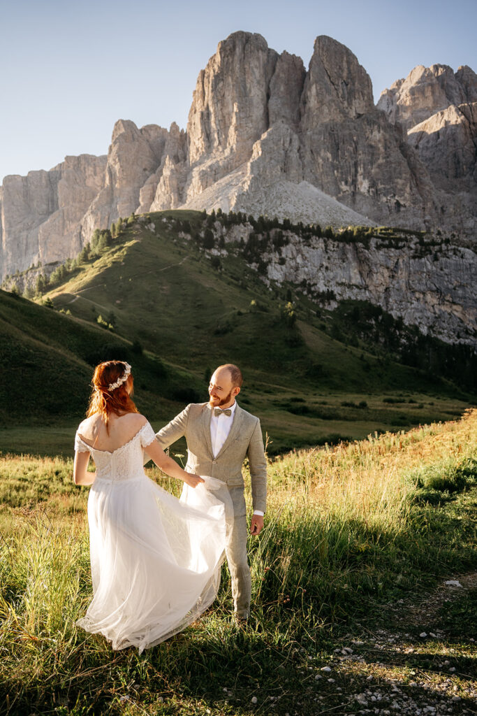 Bride and groom in mountain landscape wedding photo.