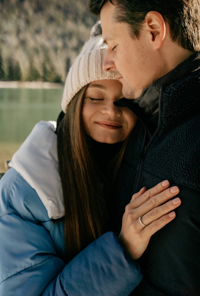 Couple embracing in cozy winter clothing