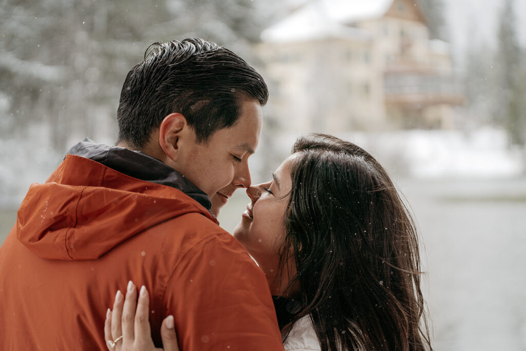 Couple embracing in snowy winter landscape