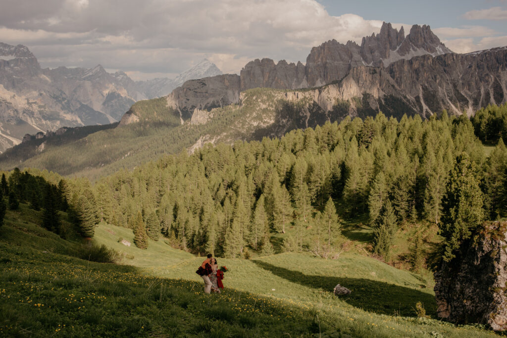 Couple walking in scenic mountain forest view