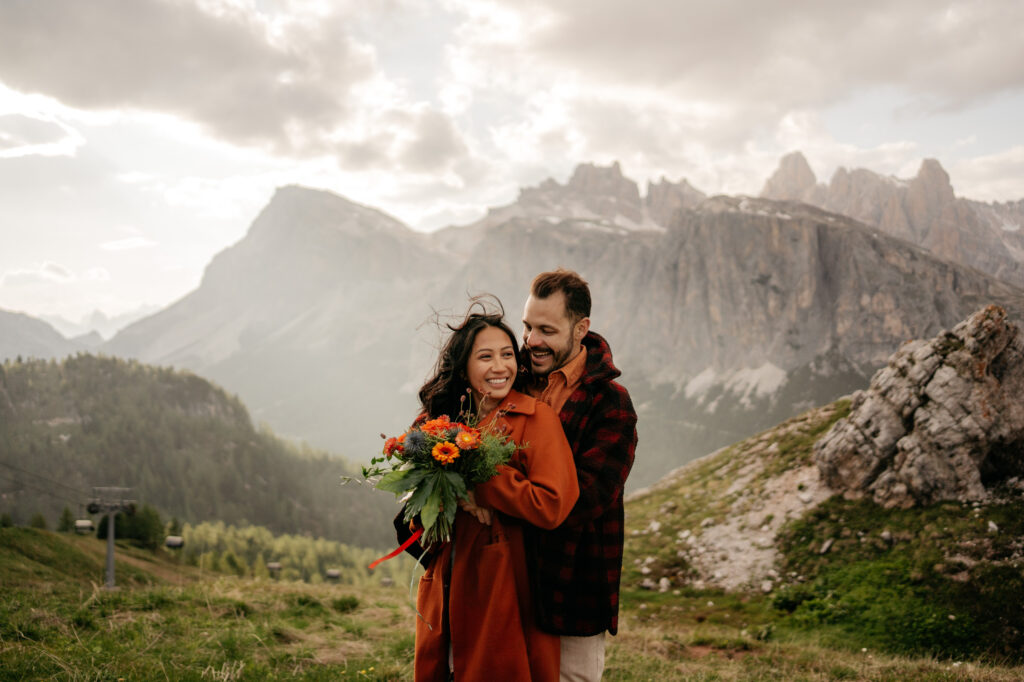 Couple embracing with mountain landscape background