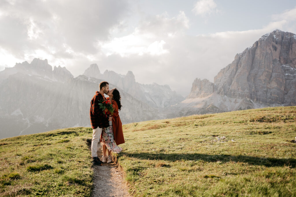 Couple kissing in mountain landscape