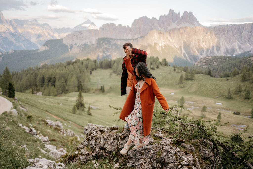 Couple exploring scenic mountain landscape together