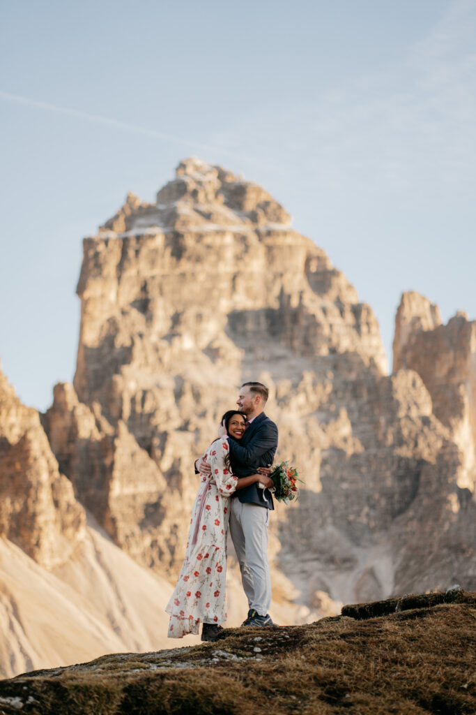 Couple embracing on a mountain backdrop