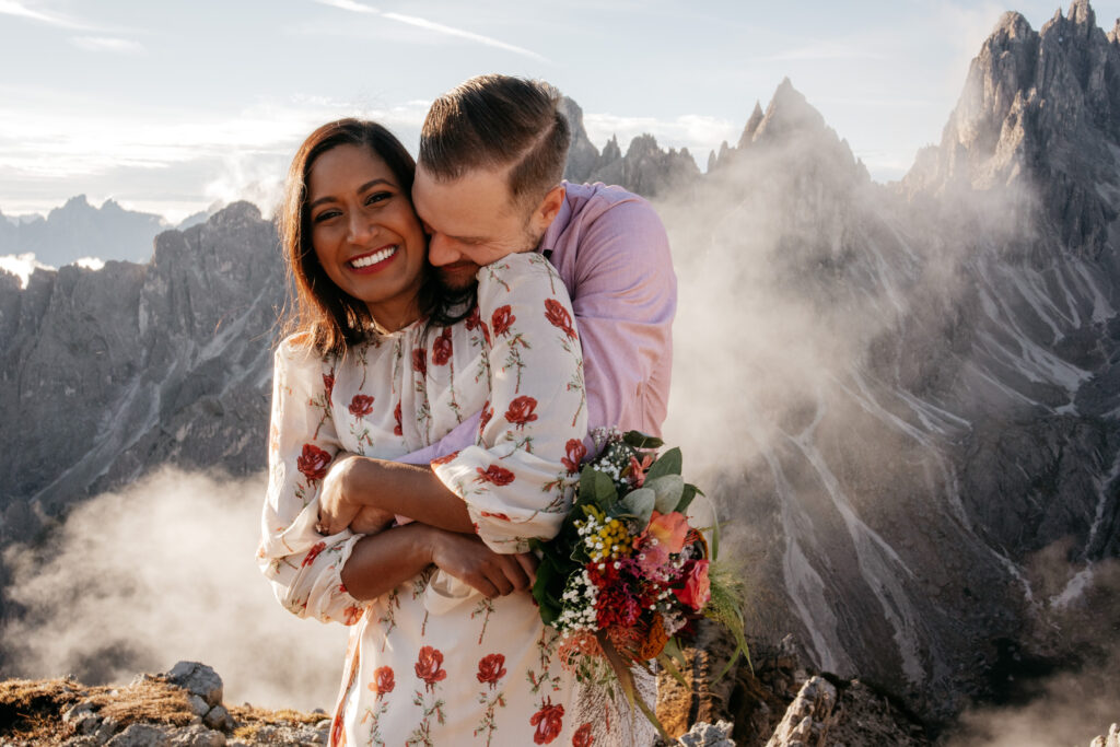 Happy couple embracing in mountain landscape