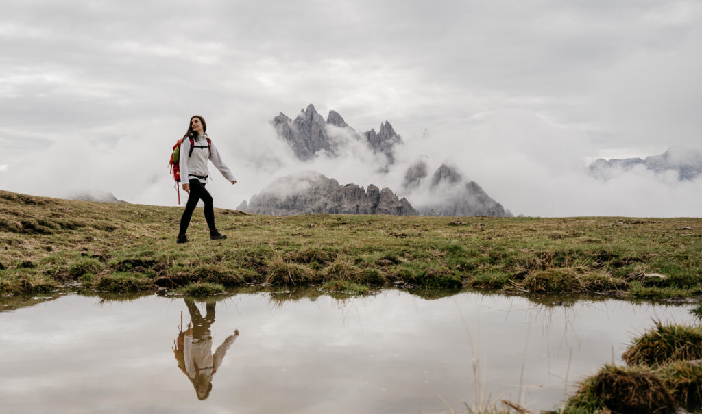 Naty Lizzy hiking near misty mountain landscape