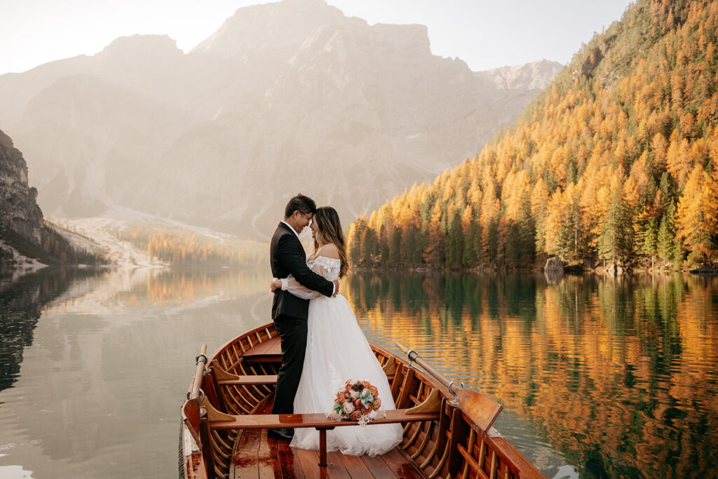 Couple embracing in boat on scenic lake