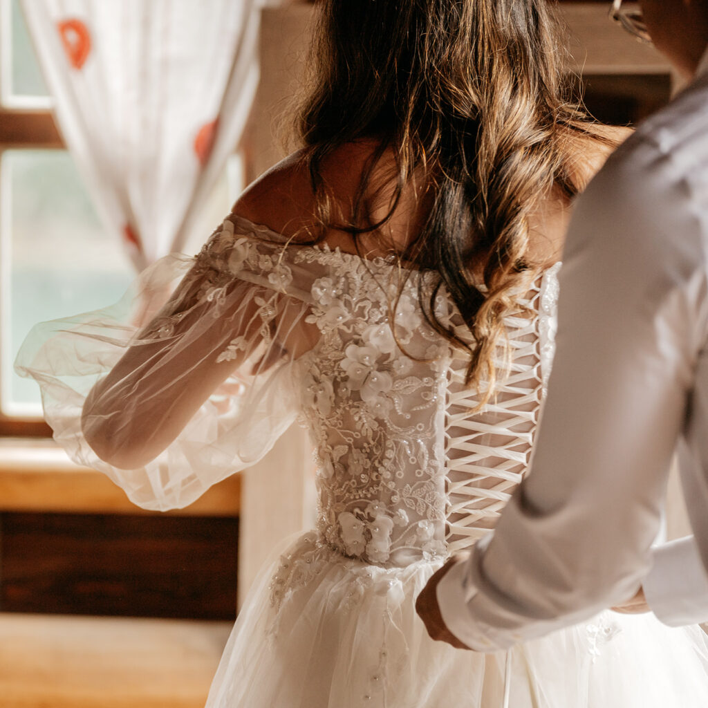 Bride wearing lace-up wedding dress