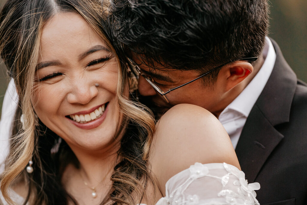 Happy couple embracing and smiling.