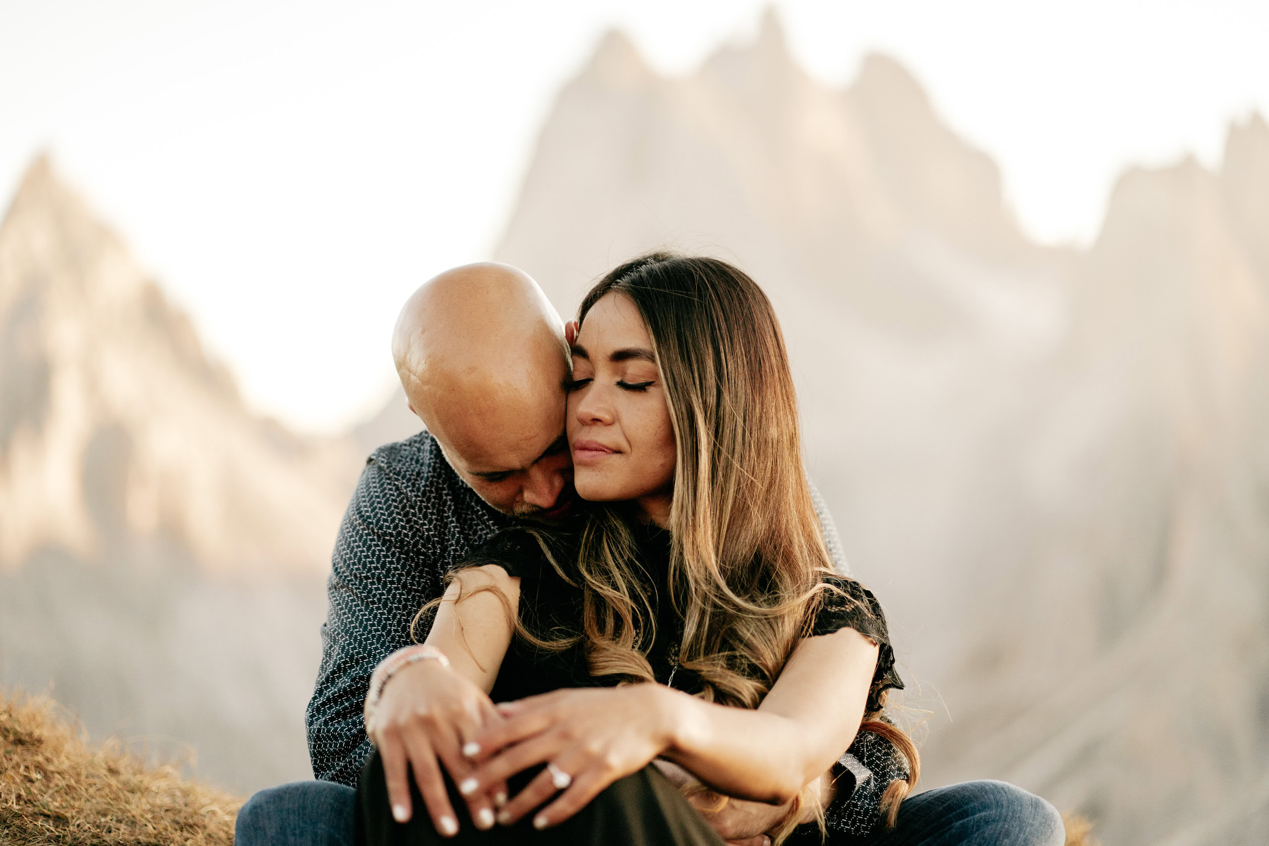 Couple embracing in outdoor mountain setting