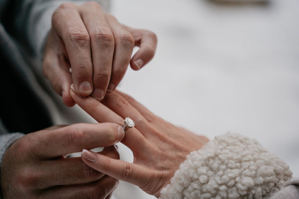 Placing engagement ring on finger