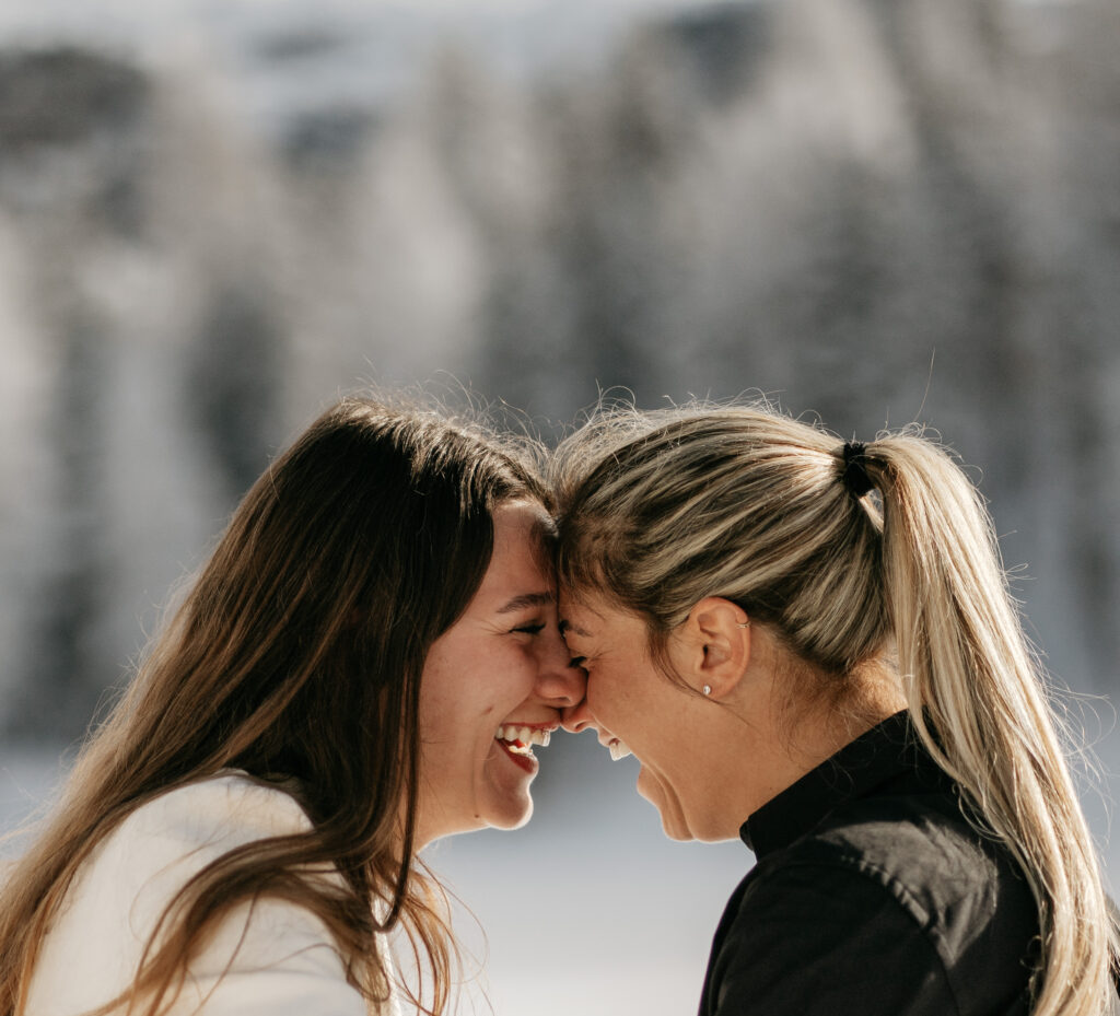 Two women laughing together outdoors