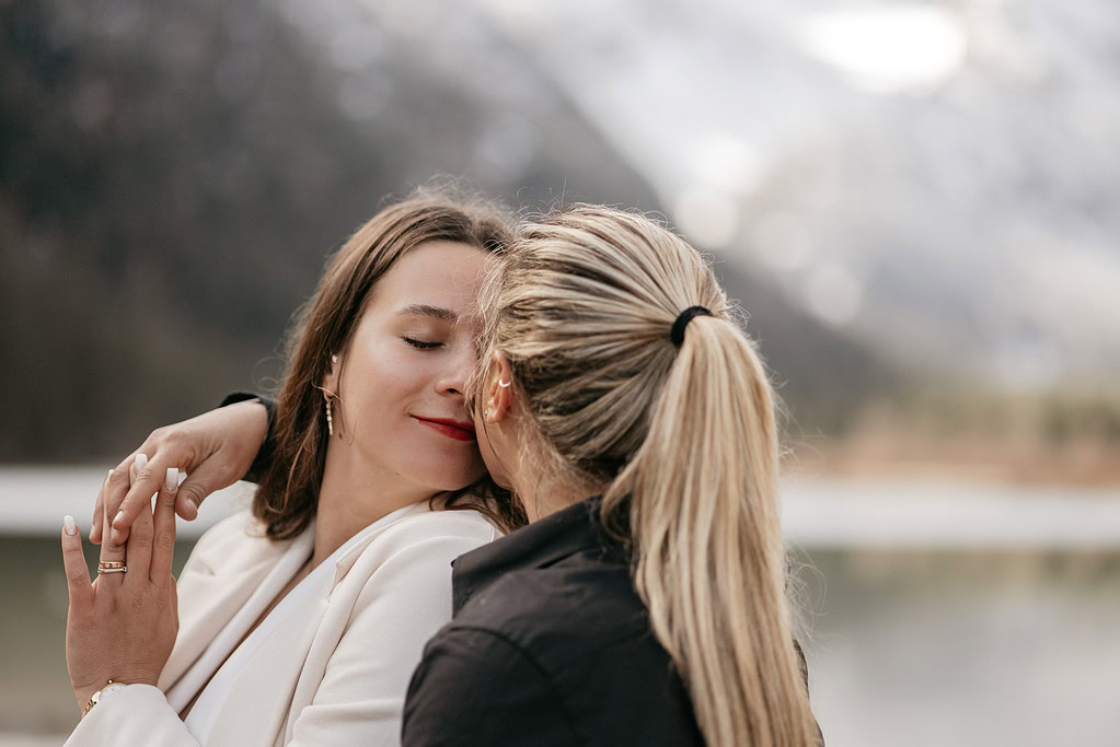 Couple sharing an intimate moment outdoors.