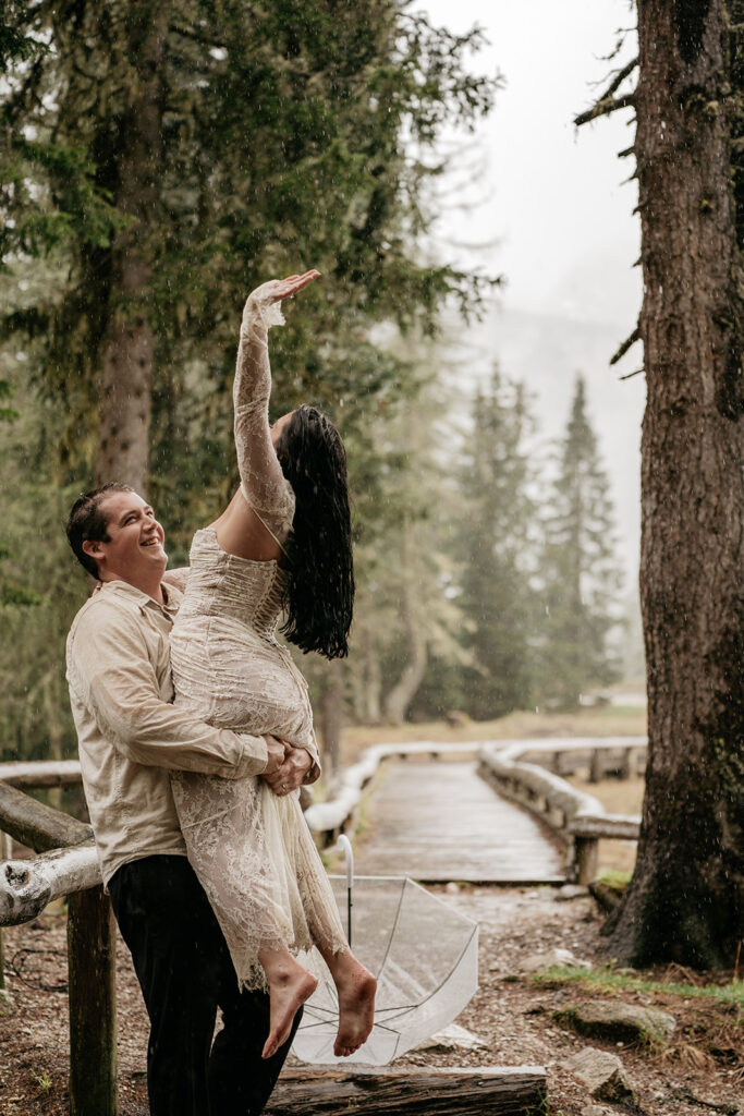 Couple dancing in the rain, forest background