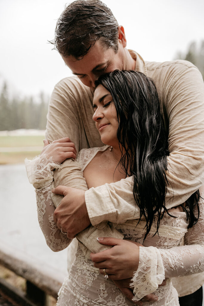 Couple embracing in the rain