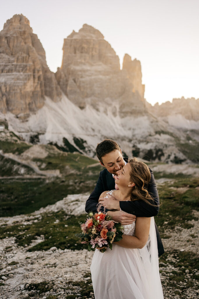 Couple embracing in mountain landscape during sunset