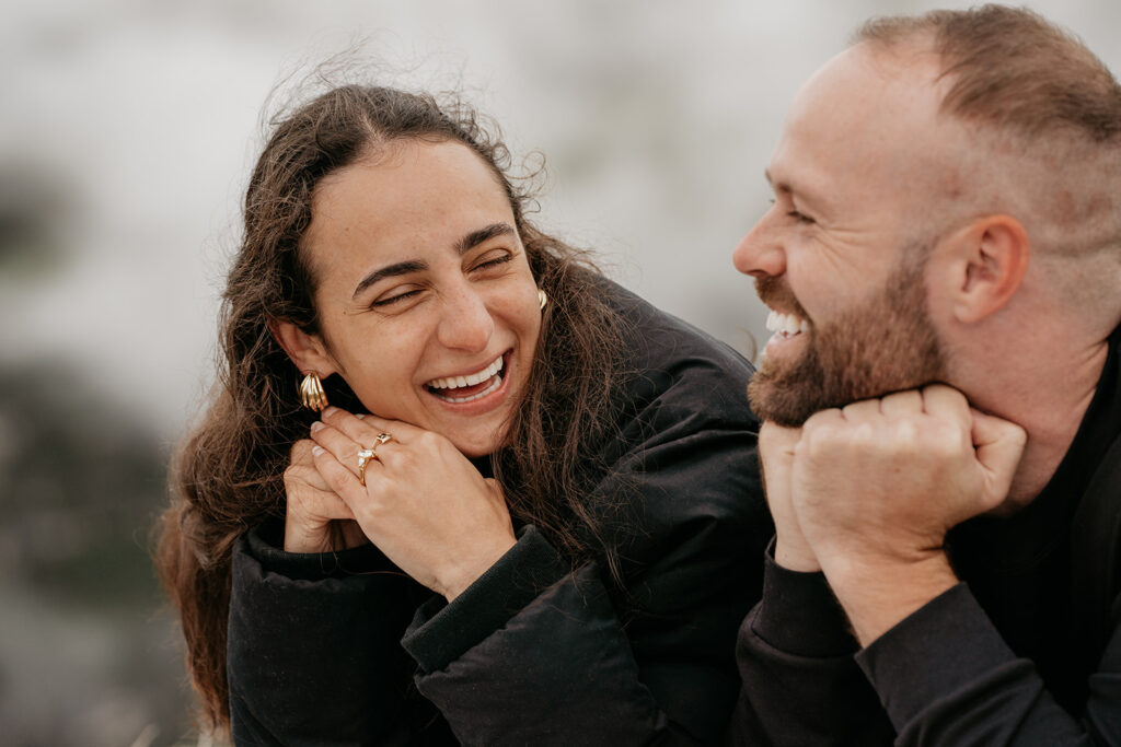 Smiling couple enjoying a joyful moment together.