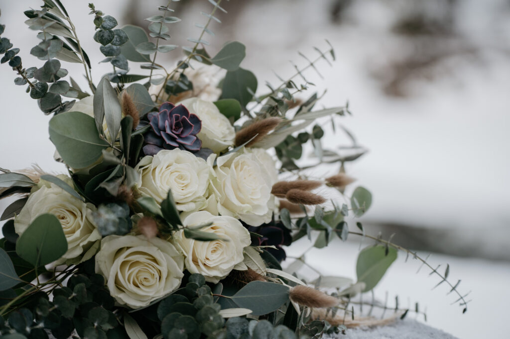 Winter bouquet with roses and greenery